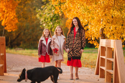 Group of people with dog during autumn