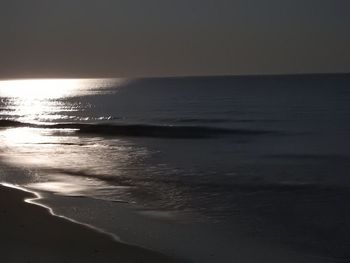 Scenic view of sea against clear sky at sunset