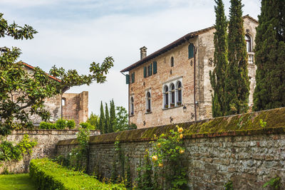 Low angle view of old building against sky