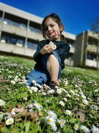Full length of woman on pink flowering plants