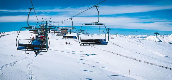 Overhead cable car on snow covered landscape