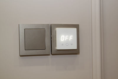 Close-up of illuminated text on wall at home