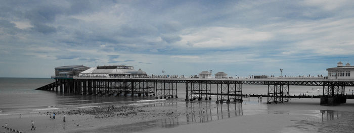 Pier over sea against sky