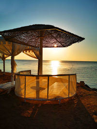 Scenic view of sea against clear sky during sunset