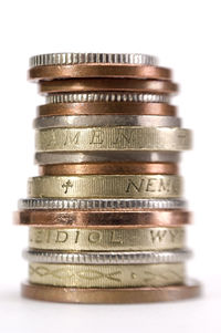 Stack of coin against white background