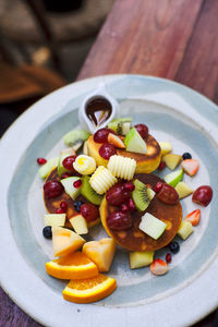 High angle view of fruits in bowl on table