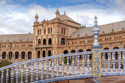 Plaza de espana at sevilla. facade of historic building against sky