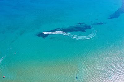 Aerial view of boat sailing in sea