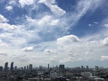 Modern buildings in city against sky