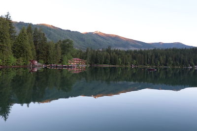 Scenic view of lake and mountains against clear sky