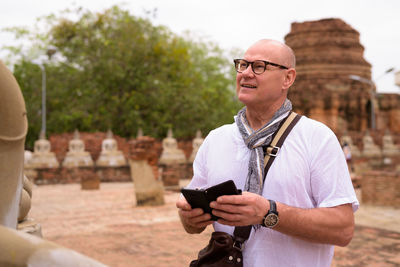 Portrait of young man using mobile phone