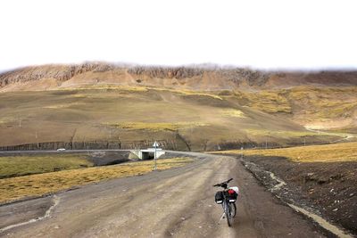 Man riding bicycle on road