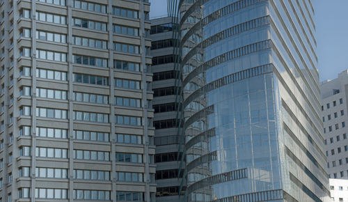 Low angle view of office buildings against sky