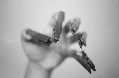 High angle view of human hand with clothespin