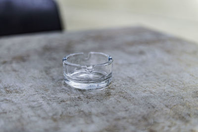 Empty glass ashtray on restaurant table