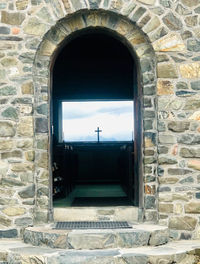 Building seen through arch window