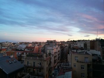 Cityscape against sky during sunset