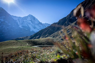 Scenic view of snowcapped mountains against clear sky