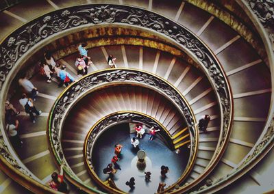 High angle view of people on spiral staircase