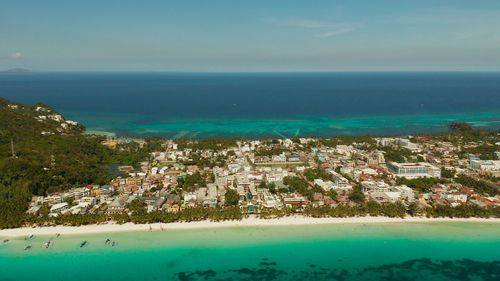 Tropical lagoon with turquoise water and white sand beach boracay, philippines. 