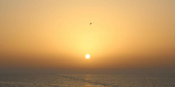 Scenic view of sunset over sea