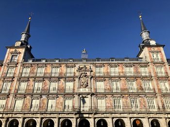 Low angle view of building against blue sky