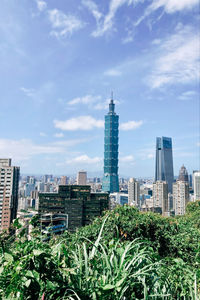 Modern buildings against sky in city