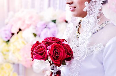 Woman with pink roses