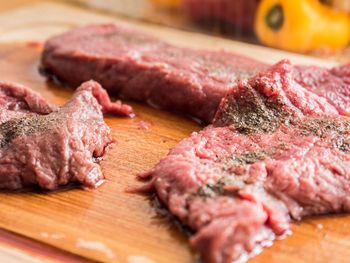 Close-up of meat on cutting board