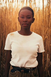 Portrait of young woman standing outdoors