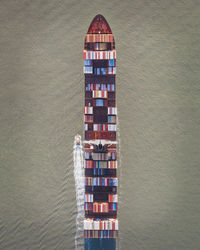 Aerial view of container ship in sea 