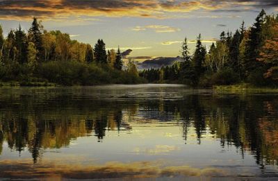 Scenic view of lake at sunset