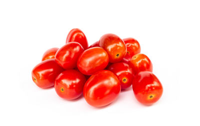 Close-up of tomatoes against white background