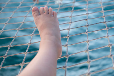 Close-up of human foot against blurred background