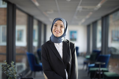 Portrait of smiling businesswoman in hijab