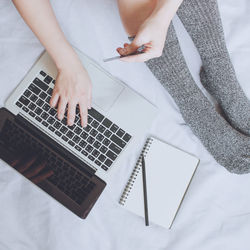 Midsection of woman using mobile phone