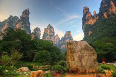 View of rock formation on mountain against sky