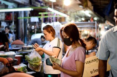 Group of people in restaurant at market