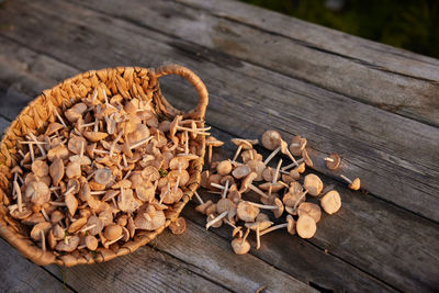 Close-up of roasted coffee beans on wooden table