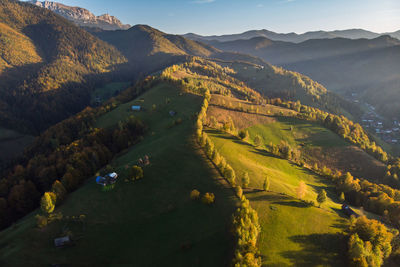 High angle view of land and mountains against sky