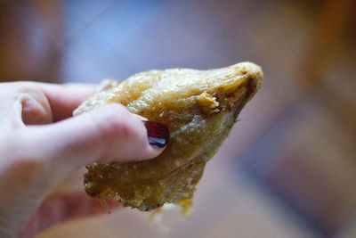 Close-up of hand holding ice cream