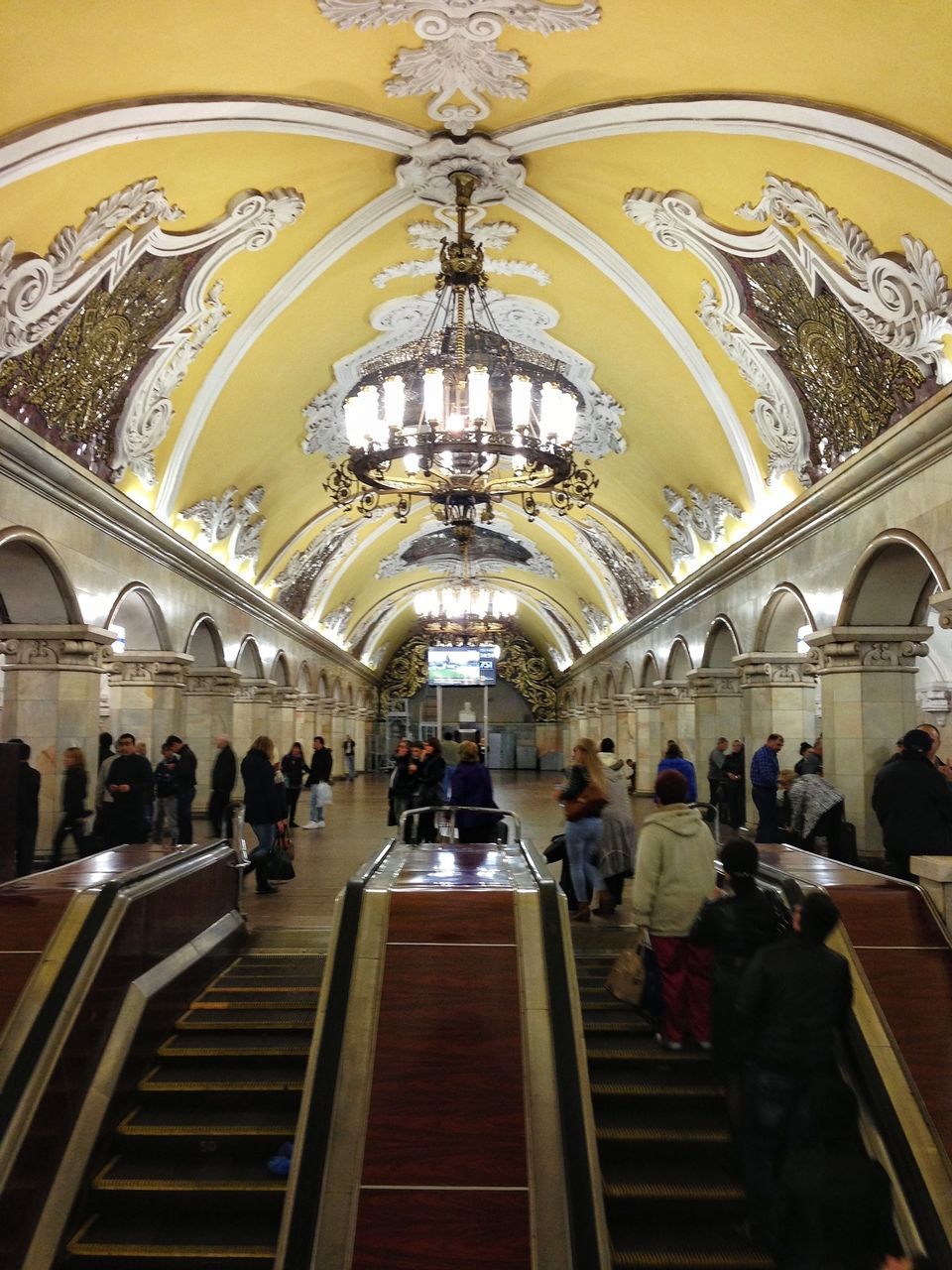 indoors, architecture, ceiling, large group of people, built structure, arch, travel, men, person, famous place, travel destinations, illuminated, tourism, railroad station, place of worship, religion, lifestyles, architectural column, lighting equipment