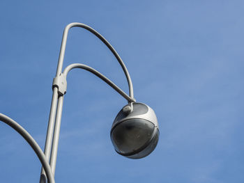 Low angle view of street light against sky