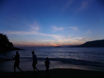 Scenic view of sea against sky at sunset