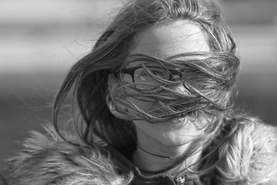 Close-up portrait of girl with tousled hair