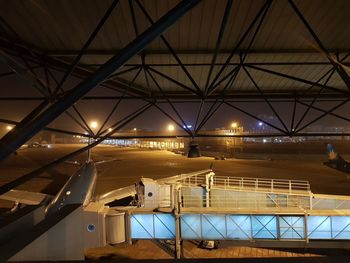 Low angle view of illuminated railroad station at airport