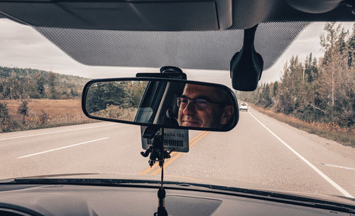 Road seen through car windshield