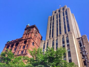 Low angle view of built structure against clear blue sky