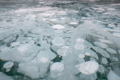 High angle view of ice floating on lake