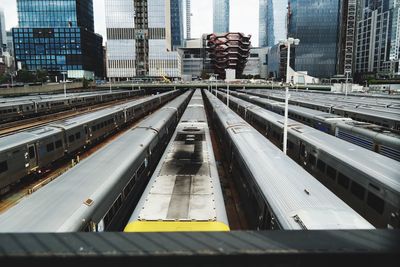 High angle view of railroad tracks amidst buildings in city